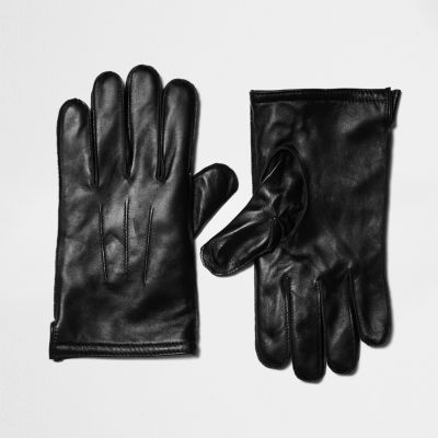 Black leather gloves in a gift box